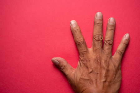 Hands on a red backgroundの写真素材