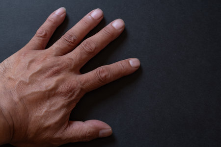 Hands on a black backgroundの写真素材