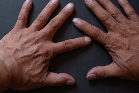 Hands on a black backgroundの写真素材