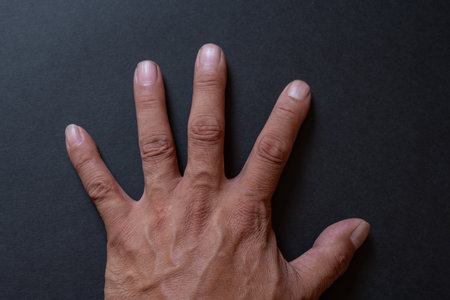 Hands on a black background