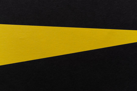 Overlapping yellow and black construction paperの写真素材