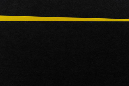 Overlapping yellow and black paperの写真素材