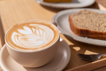 Drinking coffee in a stylish cafeの写真素材