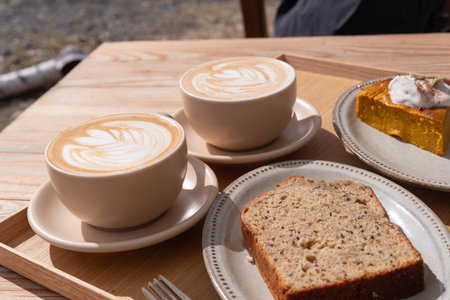 Drinking coffee in a stylish cafeの写真素材