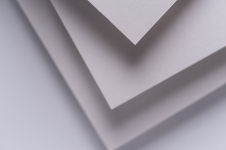 Overlapping white construction paper