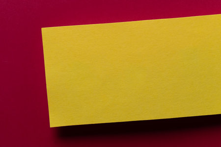 Overlapping red and yellow construction paper