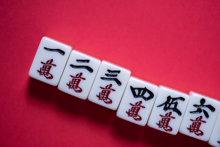 Mahjong tiles on a red backgroundの写真素材