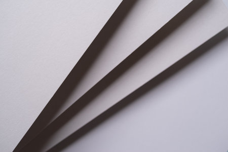 Overlapping white construction paper