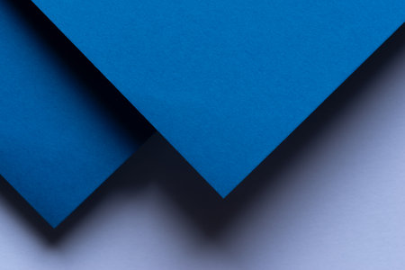 Overlapping blue and white construction paperの写真素材