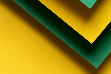Overlapping green and yellow construction paperの写真素材