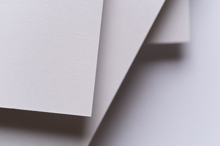 Overlapping white construction paper
