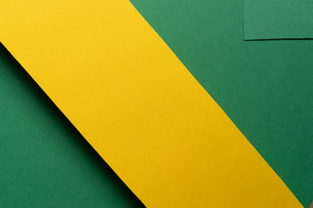 Overlapping green and yellow construction paperの写真素材