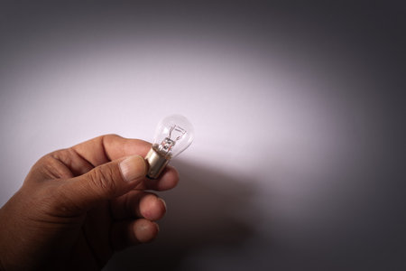 Person holding a light bulbの写真素材