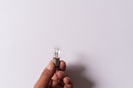 Person holding a light bulbの写真素材