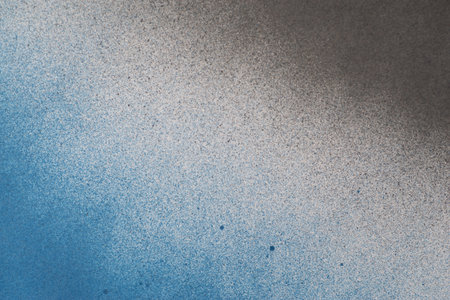 Spray paint blue and black backgroundの写真素材