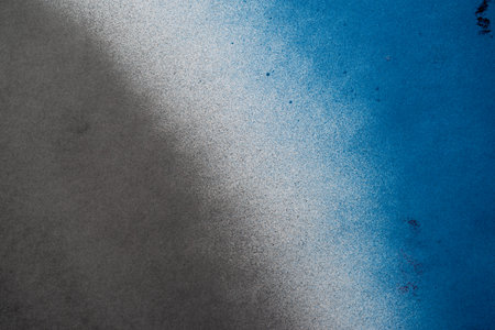 Spray paint blue and black backgroundの写真素材