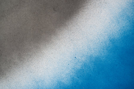 Spray paint blue and black backgroundの写真素材