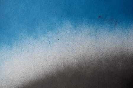 Spray paint blue and black backgroundの写真素材