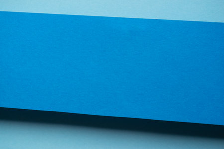 Overlapping blue construction paperの写真素材