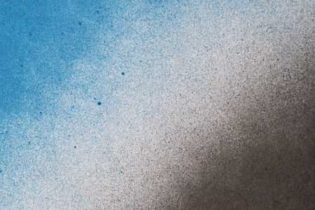 Spray paint blue and black backgroundの写真素材