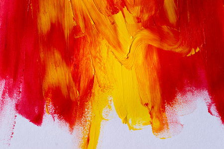 A background made of mixed red and yellow paintの写真素材