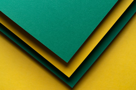 Overlapping green and yellow construction paper