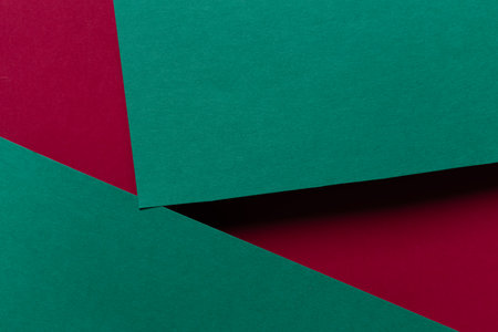Overlapping red and green construction paperの写真素材