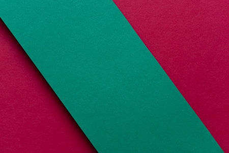 Overlapping red and green construction paperの写真素材