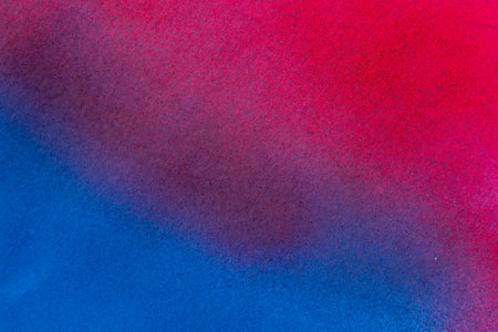 Red and blue spray paint backgroundの写真素材