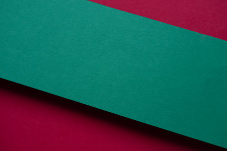 Overlapping red and green construction paperの写真素材