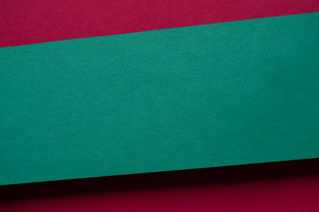 Overlapping red and green construction paperの写真素材