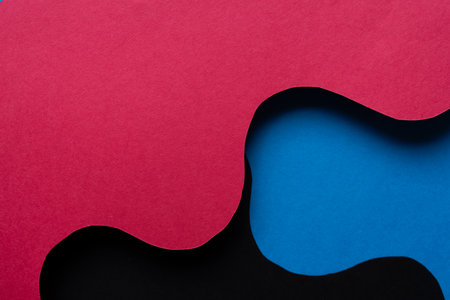 Overlapping red and blue construction paperの写真素材