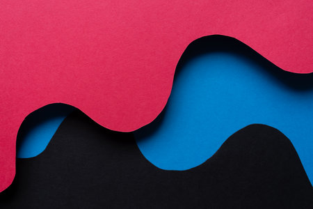 Overlapping red and blue construction paperの写真素材