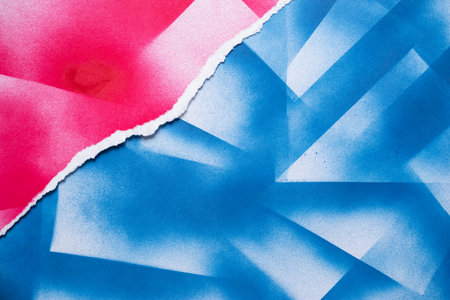 Torn blue and red paper backgroundの写真素材