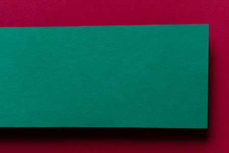 Overlapping red and green construction paperの写真素材