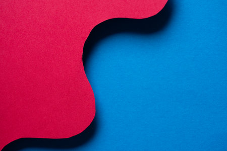 Overlapping red and blue construction paperの写真素材