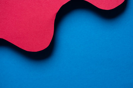 Overlapping red and blue construction paperの写真素材