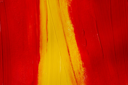 A background made of mixed red and yellow paintの写真素材