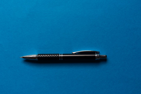 Ballpoint pen on a blue background