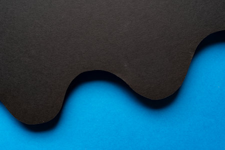 Overlapping black and blue construction paperの写真素材