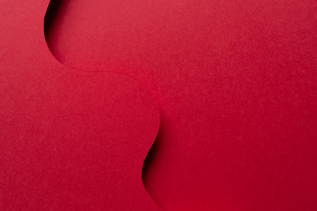 Overlapping wavy red construction paperの写真素材