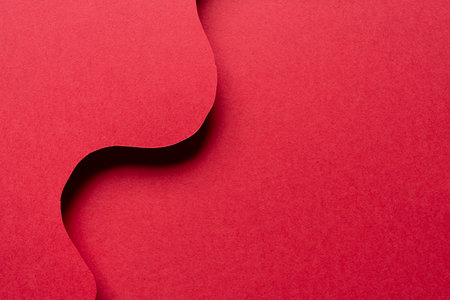 Overlapping wavy red construction paperの写真素材