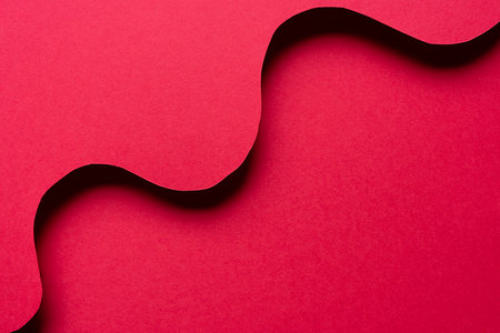 Overlapping wavy red construction paperの写真素材