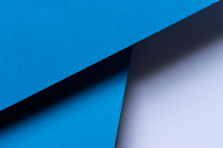 Overlapping blue and white construction paperの写真素材