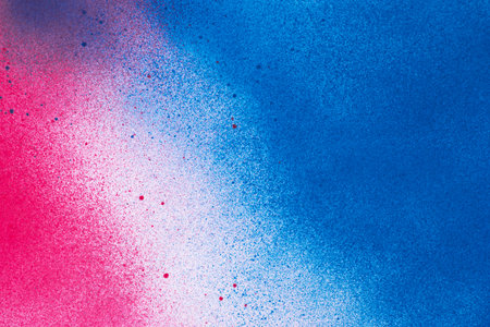 Red and blue spray paint backgroundの写真素材