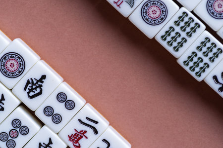 Mahjong tiles lined up on a light backgroundの写真素材