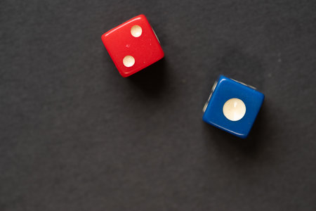 Two dice, one red and one blueの写真素材