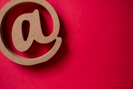 At sign on a red backgroundの写真素材