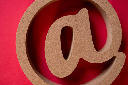 At sign on a red backgroundの写真素材