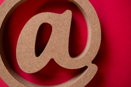 At sign on a red backgroundの写真素材